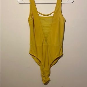 Yellow bodysuit never worn